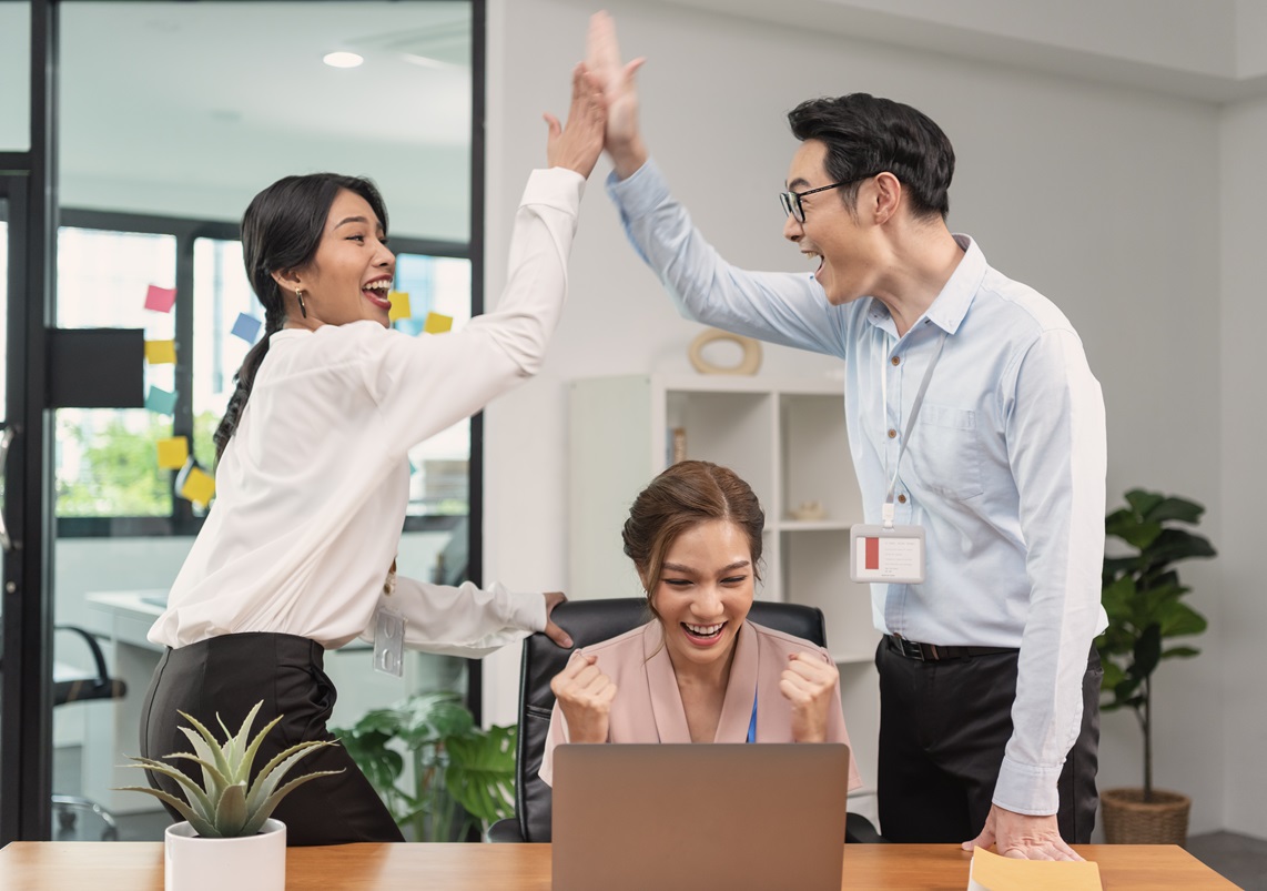 Asian businessteam smile and raise hands up celebration, feeling